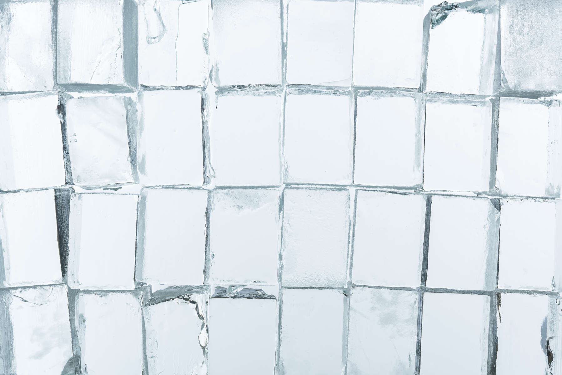 top view of transparent clear square ice cubes on mirror